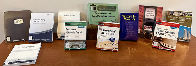 Library display with the books listed in the article arranged on a table